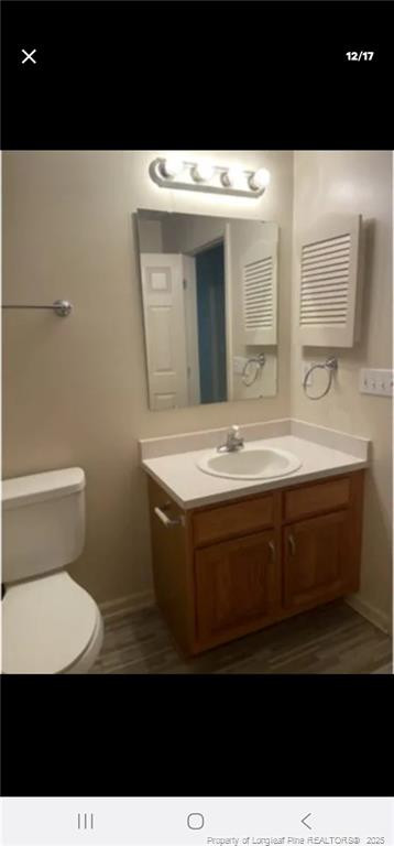 2009 Sardonyx Road, Unit 2 Fayetteville, NC 28303 - Photo 12 of 15 a bathroom with a sink a toilet and mirror