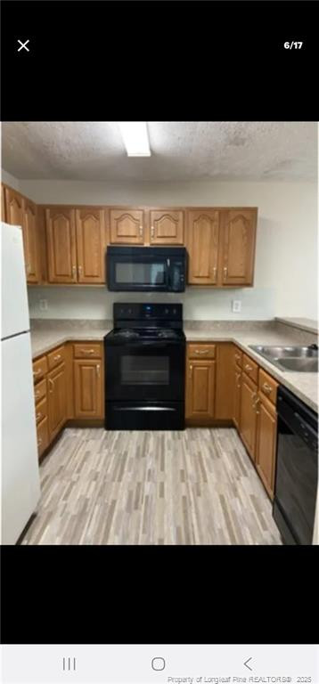 2009 Sardonyx Road, Unit 2 Fayetteville, NC 28303 - Photo 6 of 15 a view of kitchen with wooden floor