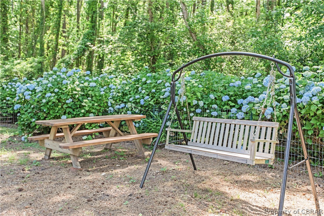 175 Seaside Way Gwynn, VA 23076 - Photo 48 of 48 a roof deck with a bench and wooden fence