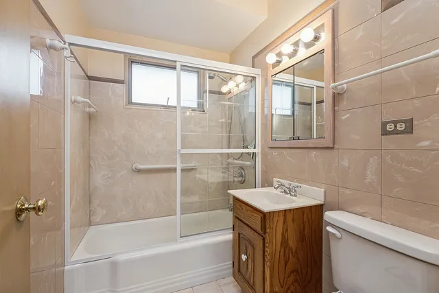 a bathroom with a shower and a sink