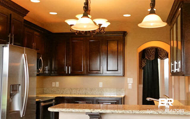 7020 Rocky Rd Loop Gulf Shores, AL 36542 - Photo 9 of 29 Kitchen has walk-in pantry and granite countertops.