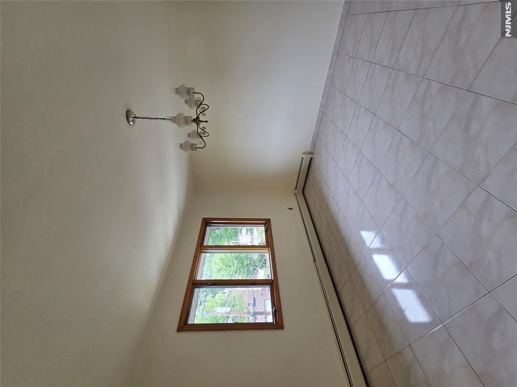 688 Day Avenue, Unit 2 Ridgefield, NJ 07657 - Photo 8 of 18 a view of an empty room with a window