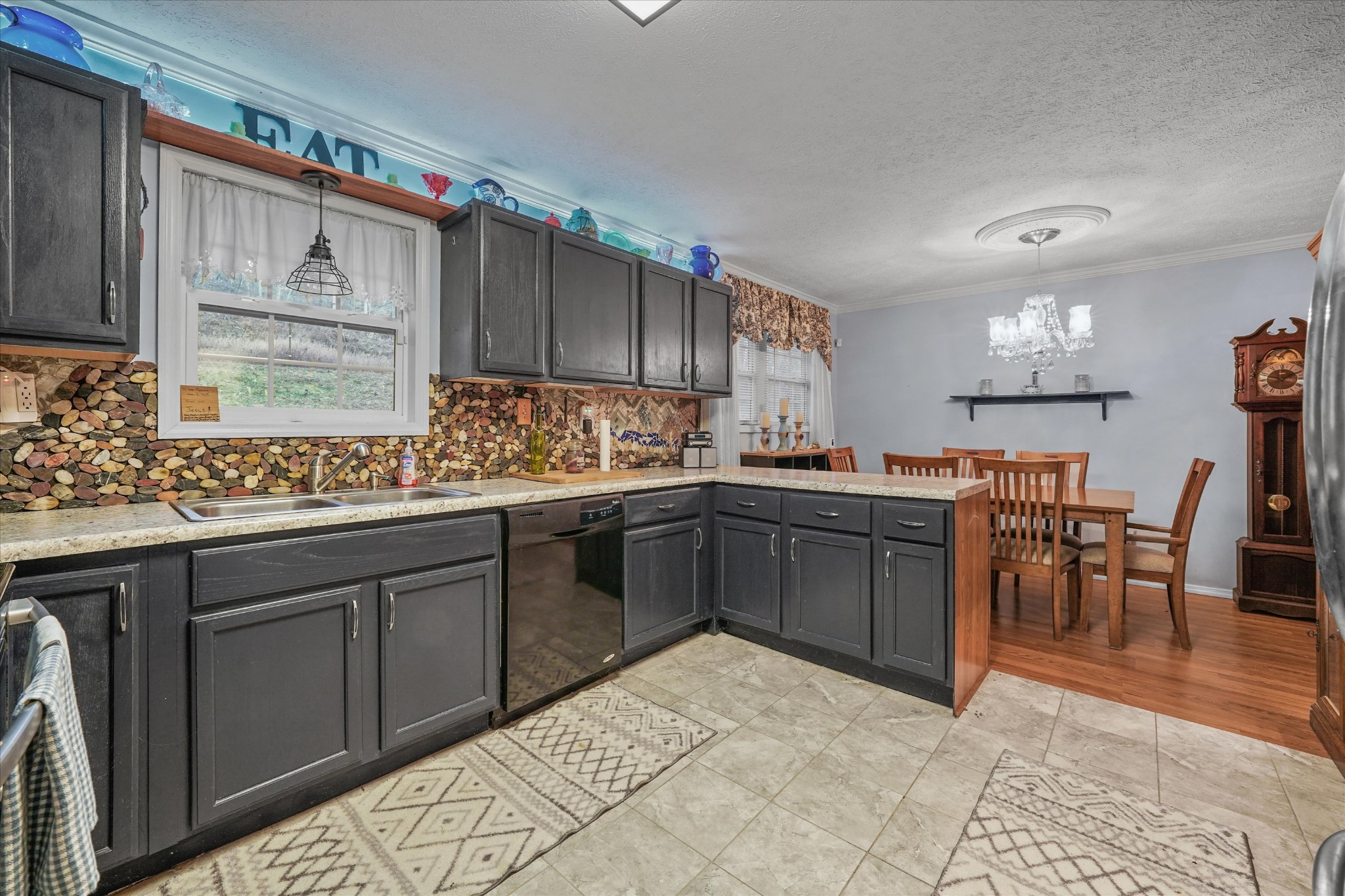 131 Scott Road Harriman, TN 37748 - Photo 16 of 51 a kitchen with a sink and cabinets