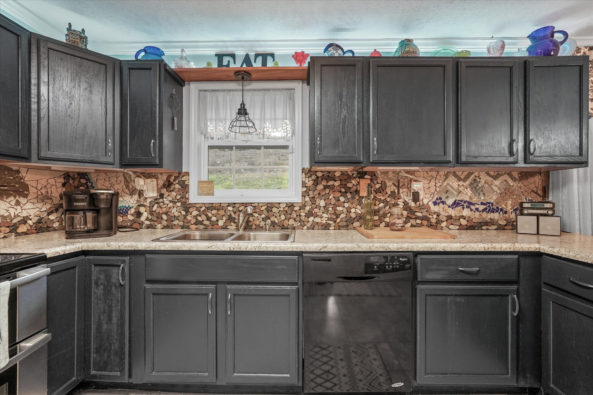 131 Scott Road Harriman, TN 37748 - Photo 19 of 51 a kitchen with a sink window and cabinets