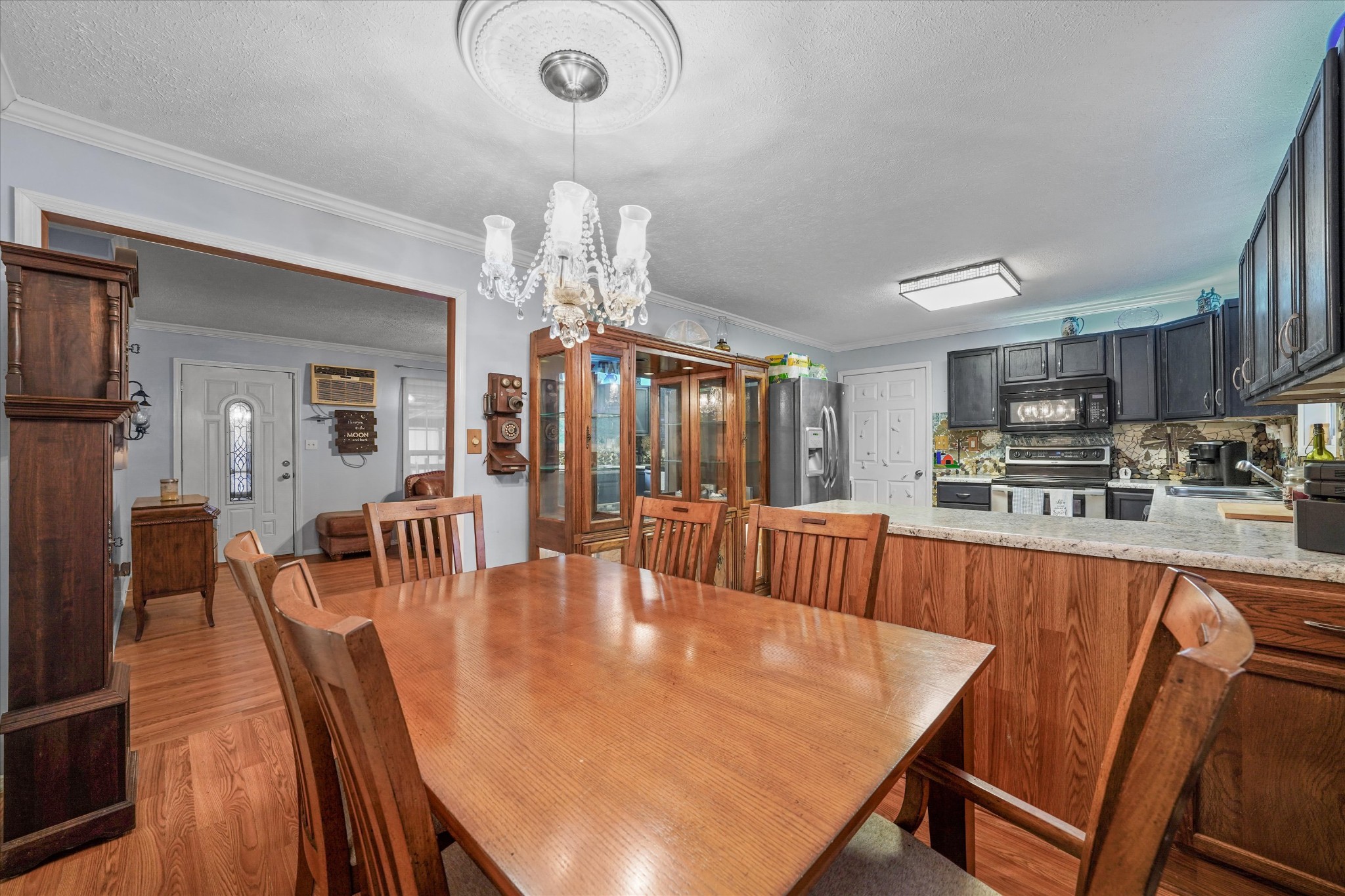131 Scott Road Harriman, TN 37748 - Photo 21 of 51 a dining room with furniture a chandelier and wooden floor