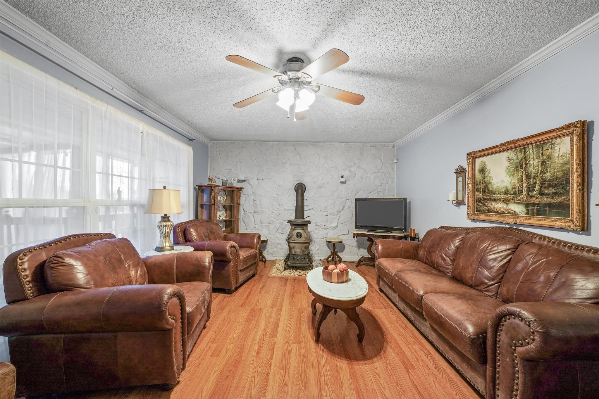 131 Scott Road Harriman, TN 37748 - Photo 22 of 51 a living room with furniture a fireplace and a large window
