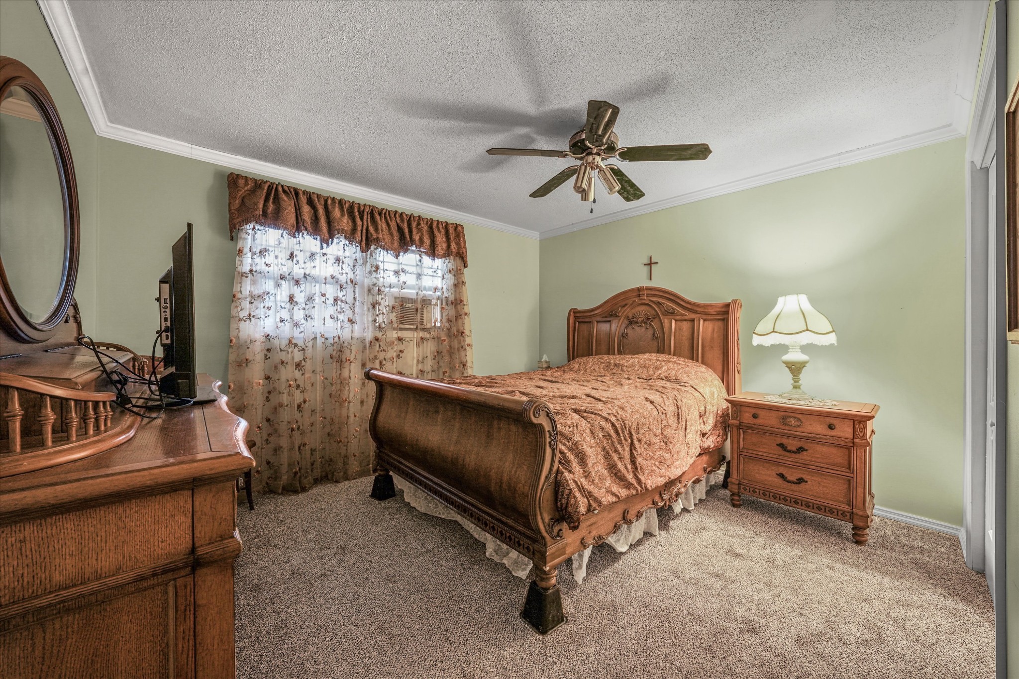 131 Scott Road Harriman, TN 37748 - Photo 32 of 51 a bedroom with a bed a mirror on the dresser and a window