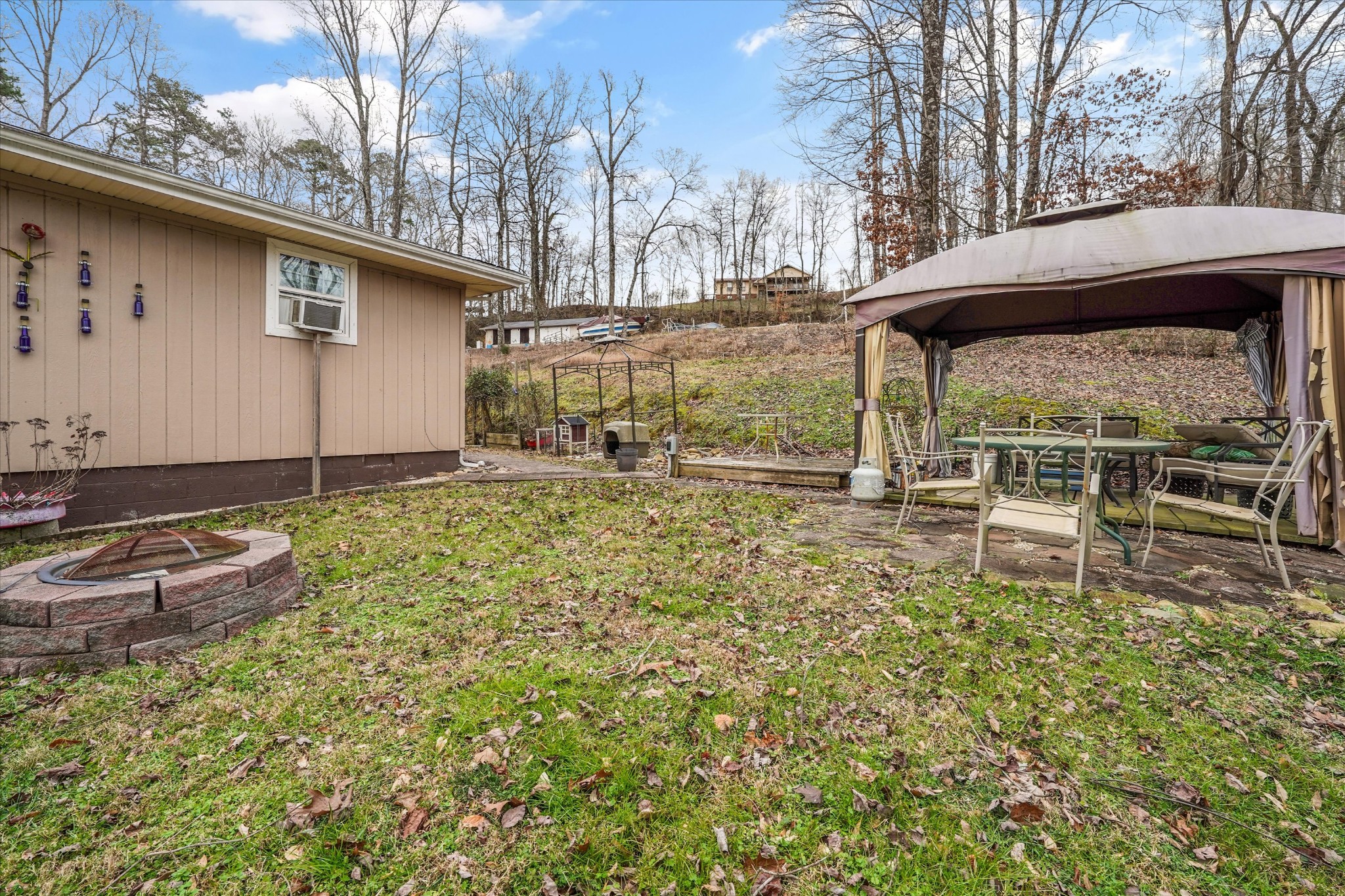 131 Scott Road Harriman, TN 37748 - Photo 46 of 51 a backyard of a house with table and chairs