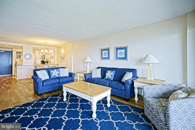 a living room with furniture and a rug
