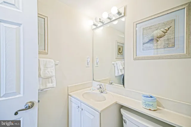 a bathroom with a sink vanity and a mirror