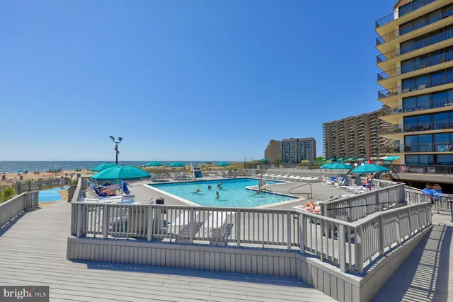 a view of a balcony with two chairs