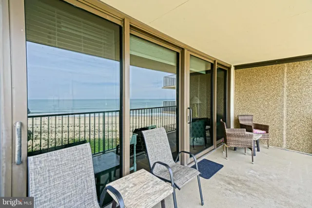a balcony view with a couch and a table