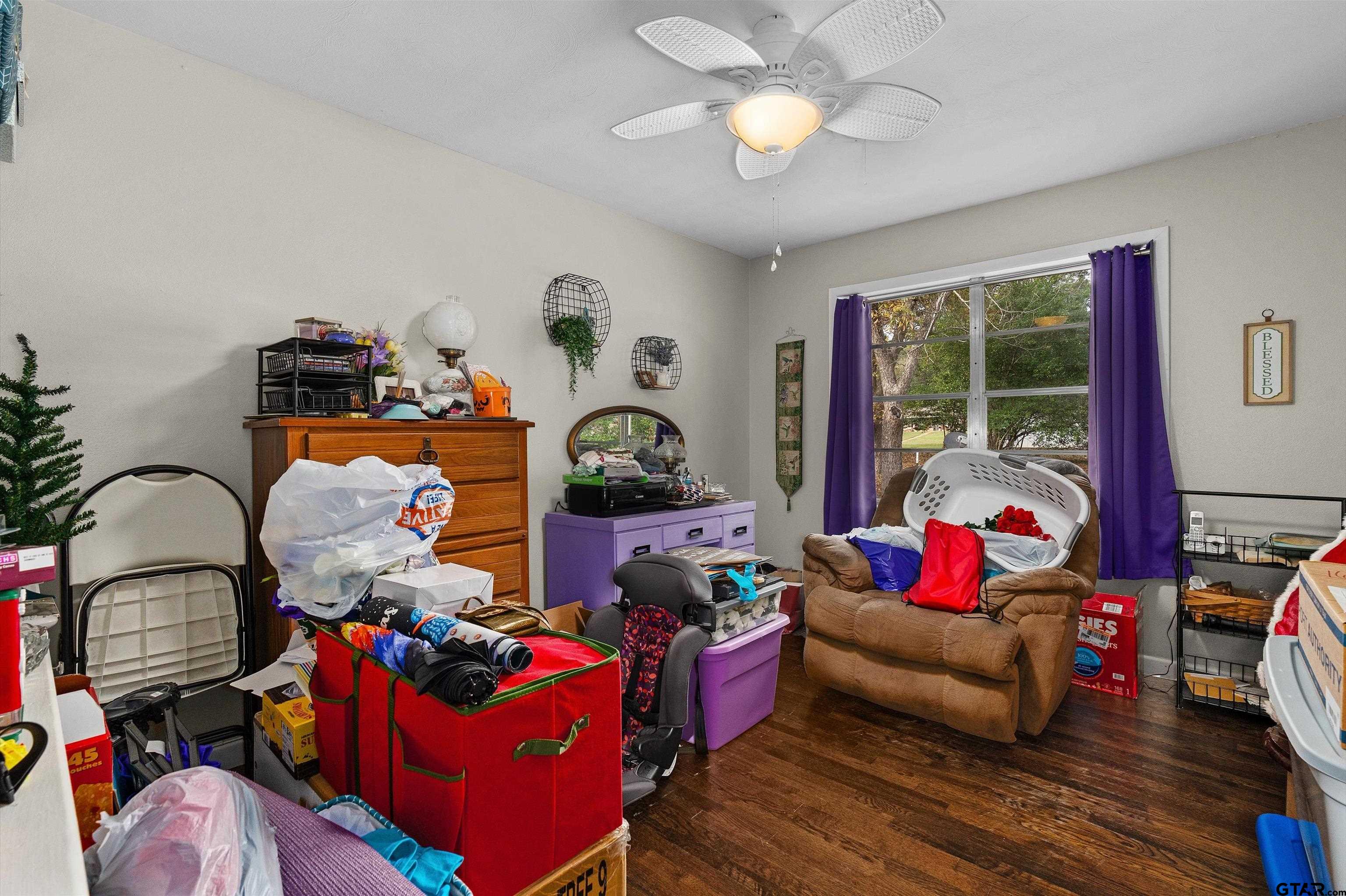 387 Hill Avenue Rusk, TX 75785 - Photo 17 of 26 a living room with furniture fireplace and a large window