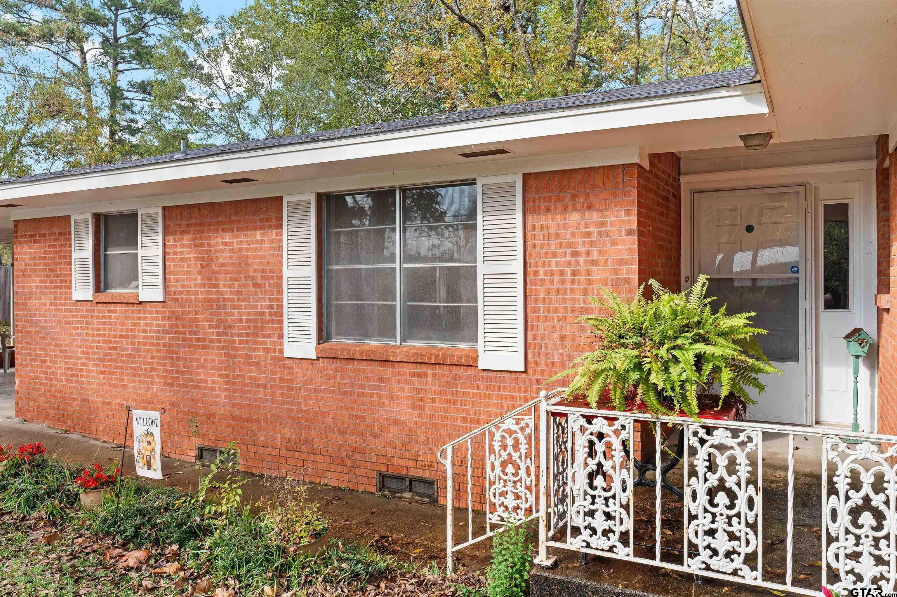 387 Hill Avenue Rusk, TX 75785 - Photo 5 of 26 a front view of a house with plants