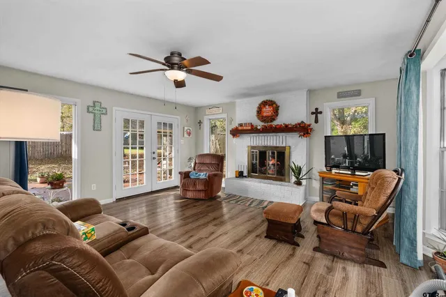 a living room with furniture or fireplace and a flat screen tv
