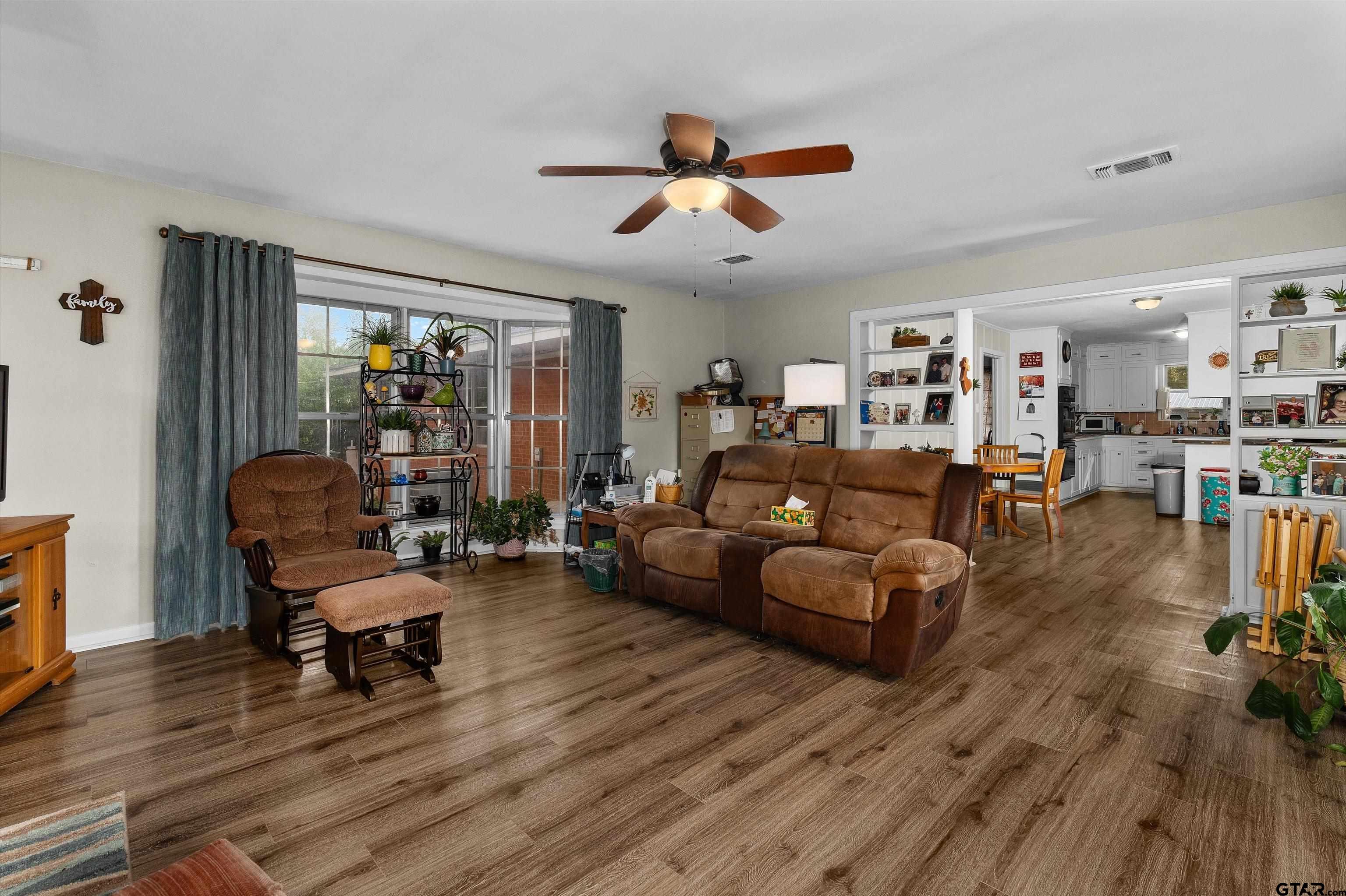 387 Hill Avenue Rusk, TX 75785 - Photo 8 of 26 a living room with furniture and a wooden floor