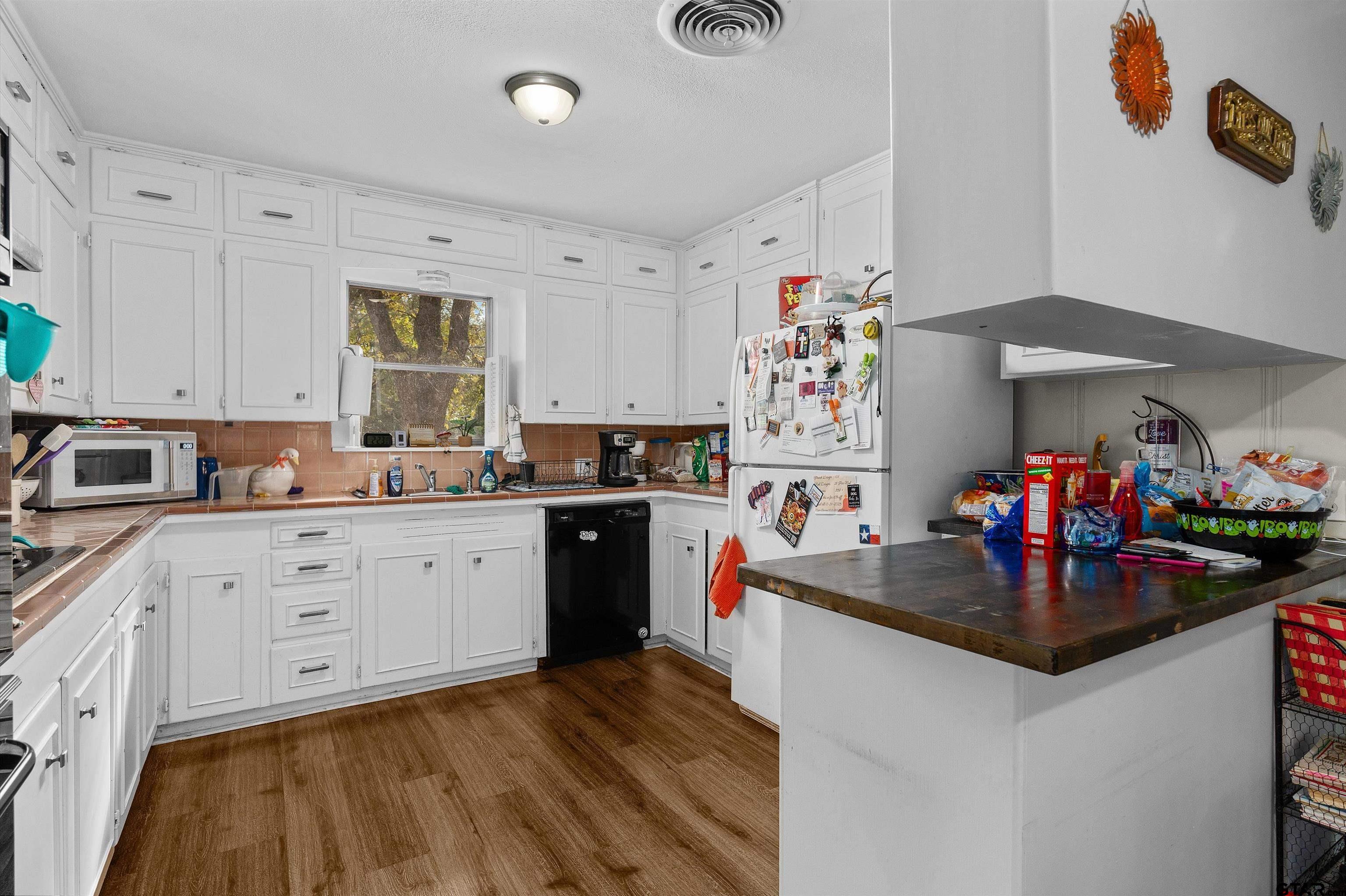 387 Hill Avenue Rusk, TX 75785 - Photo 9 of 26 a kitchen with granite countertop a sink stove and cabinets