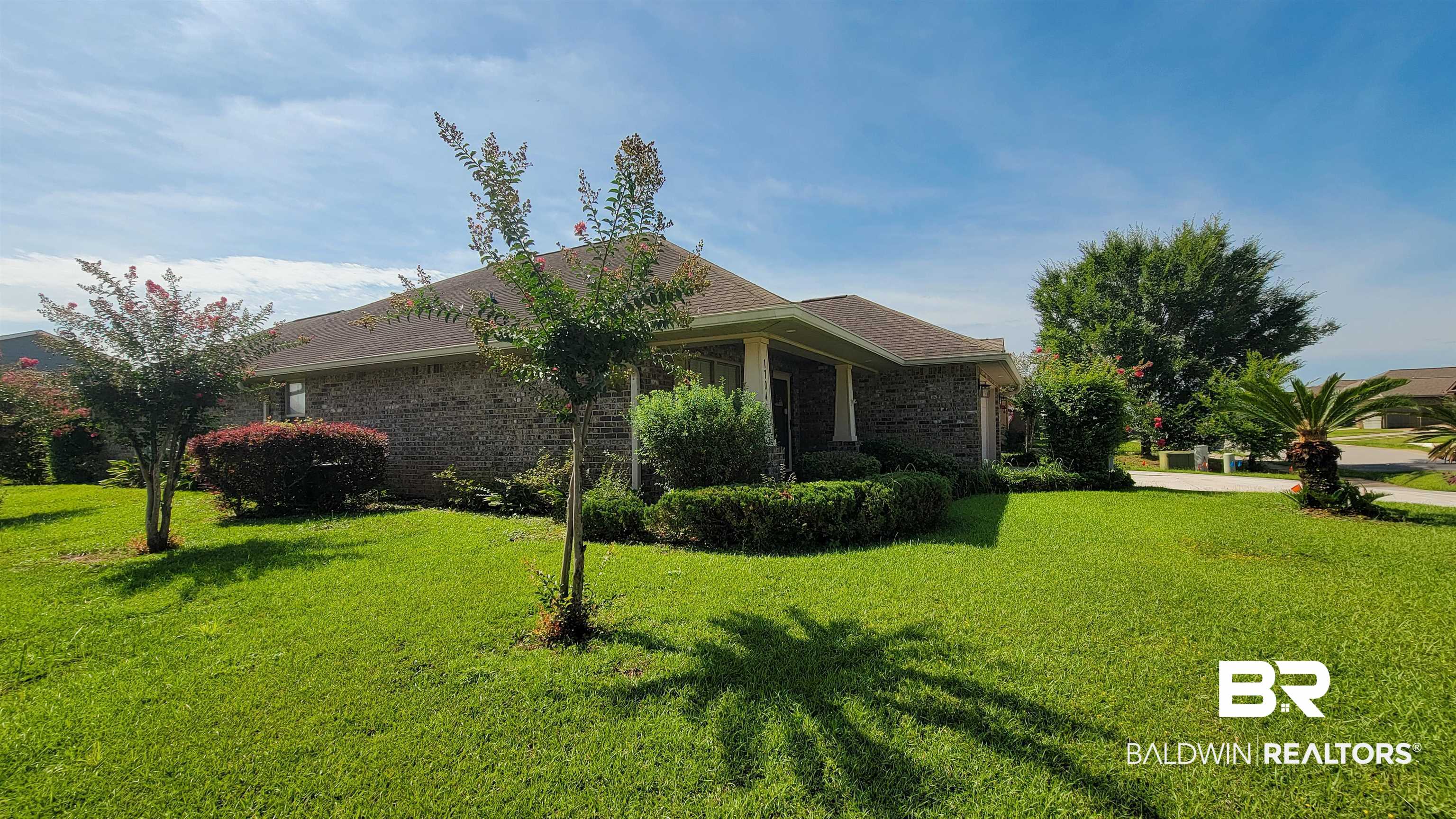 1704 Arcadia Drive Foley, AL 36535 - Photo 5 of 52 View of side of property with a yard, brick siding, and a shingled roof