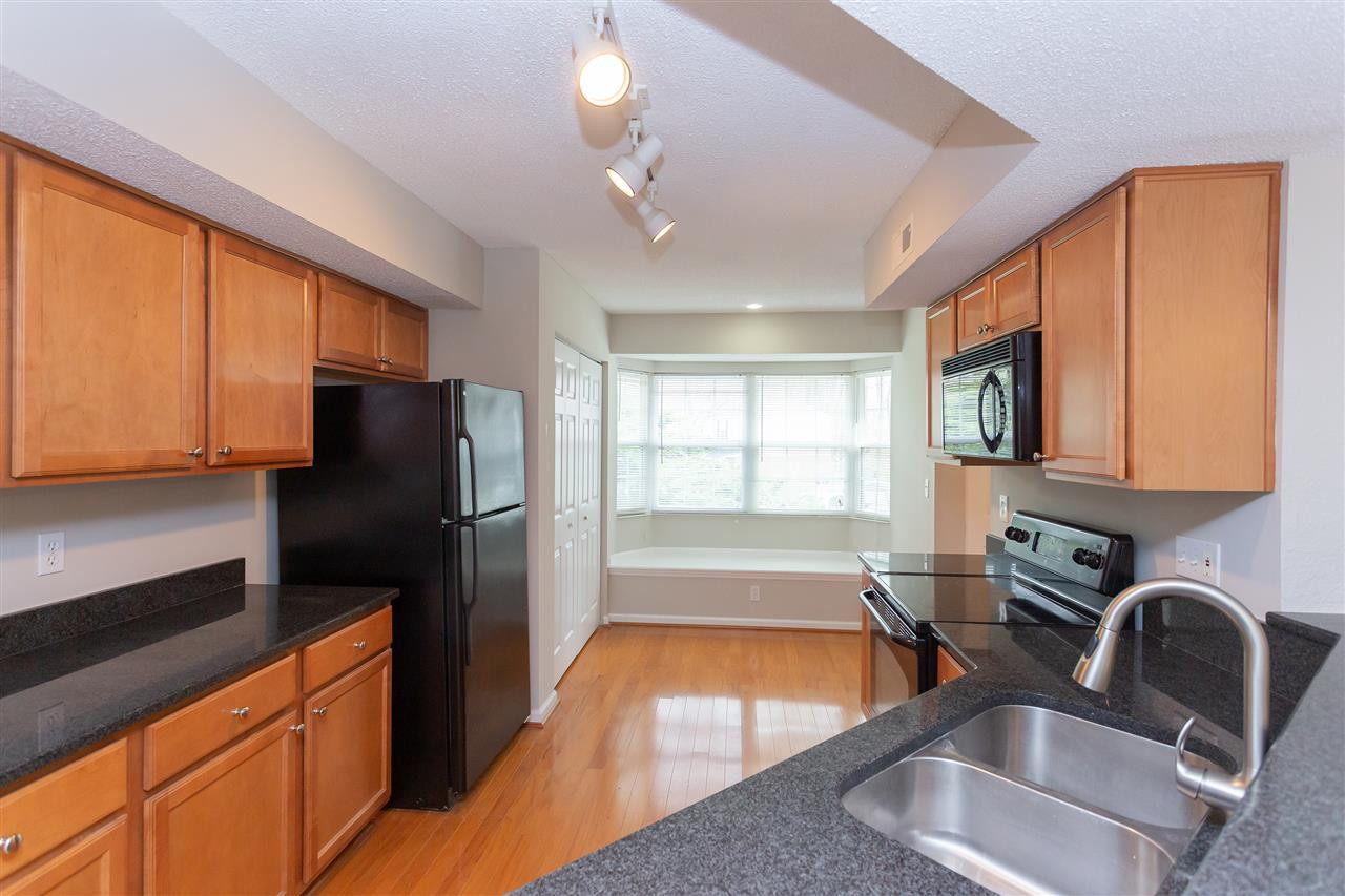 7812 Falcon Rest Circle Raleigh, NC 27615 - Photo 11 of 26 Kitchen has Granite Countertops