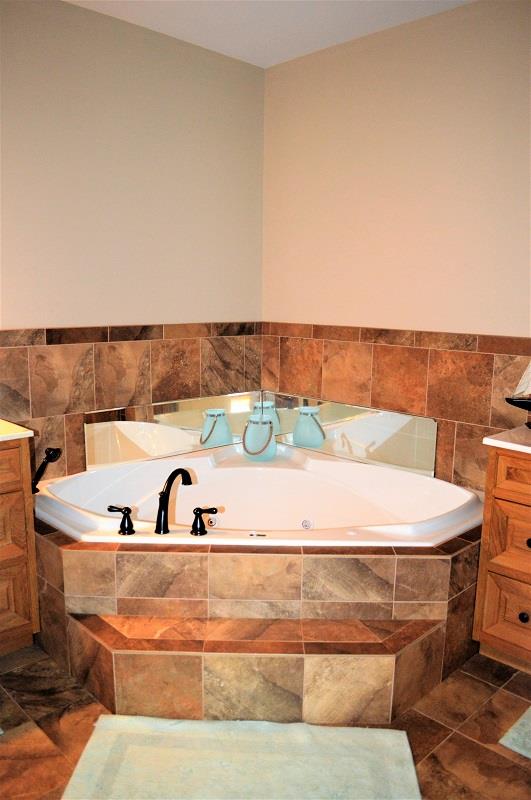 1233 Post Oak Road Belvidere, TN 37306 - Photo 14 of 30 Pamper yourself in the master bath. There's a wonderful whirlpool tub to relax in and his and her vanities too.
