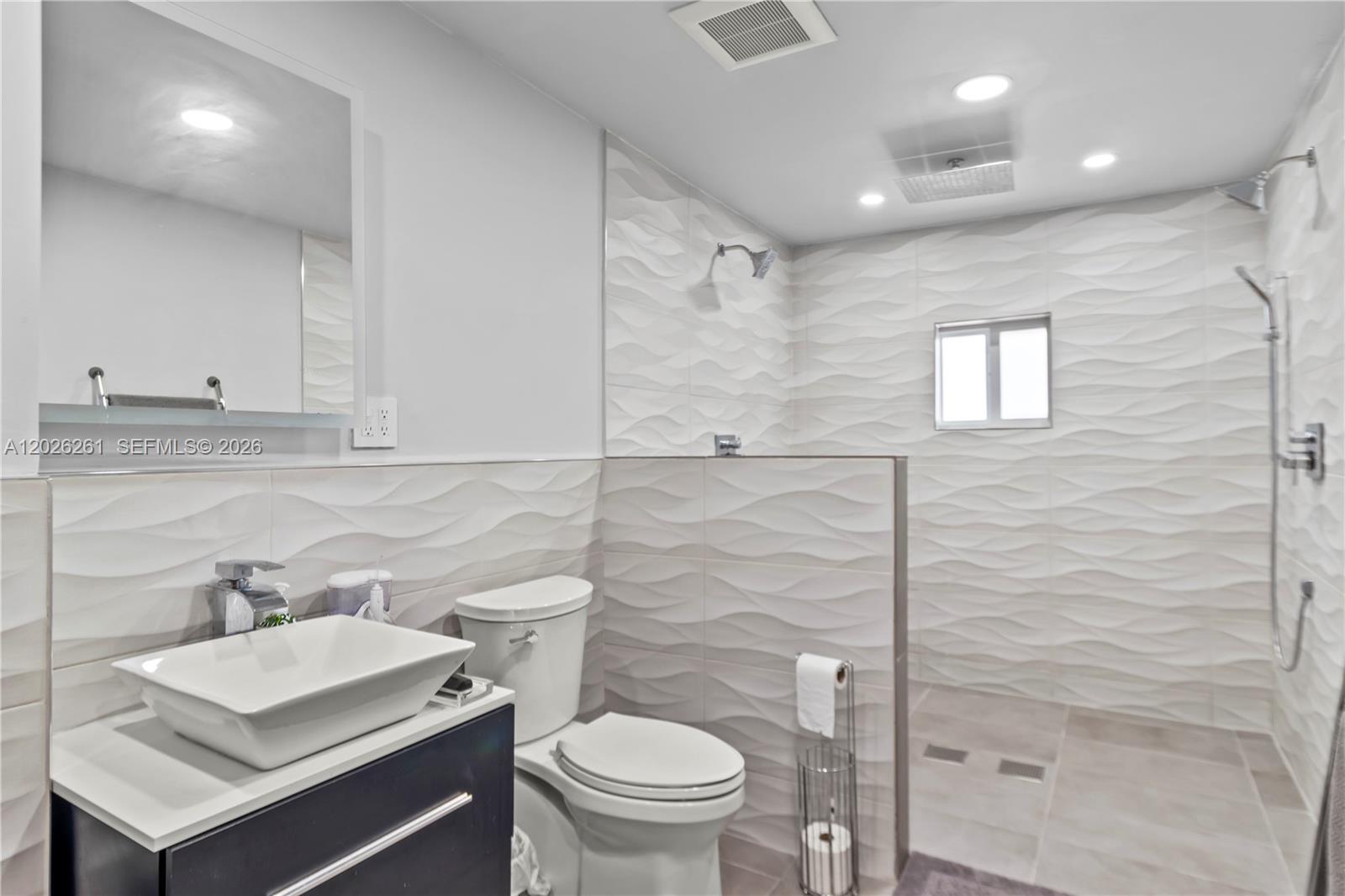 6250 Southwest 20th Terrace Miami, FL 33155 - Photo 31 of 42 a bathroom with a sink a toilet and shower