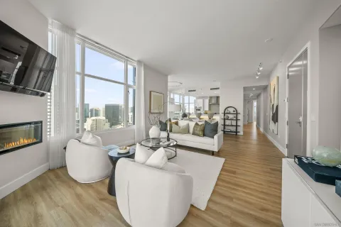 a living room with fireplace furniture and a flat screen tv