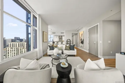 a living room with furniture and a large window