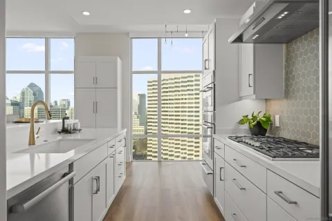 a kitchen with a sink stove and refrigerator