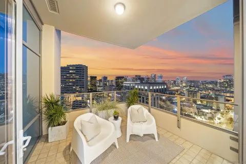 a view of a balcony with city view