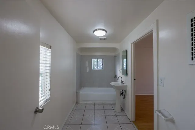 a bathroom with a bathtub and a toilet
