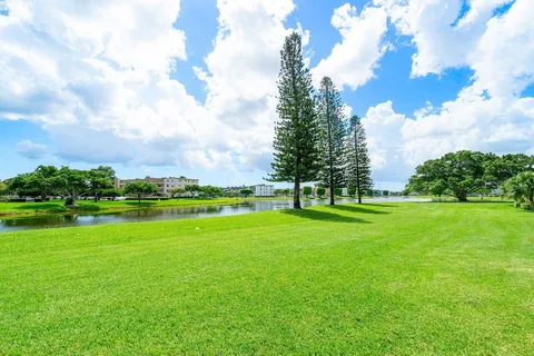 a view of a golf course with a lake