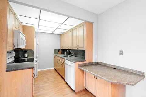 a kitchen with a stove and a refrigerator