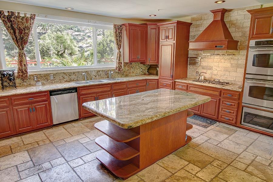 10075 Ojai Santa Paula Road Ojai, CA 93023 - Photo 5 of 17 a kitchen with stainless steel appliances granite countertop a stove a sink and a microwave