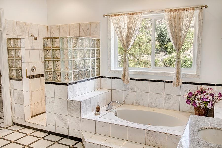 10075 Ojai Santa Paula Road Ojai, CA 93023 - Photo 8 of 17 a bathroom with a tub and shower