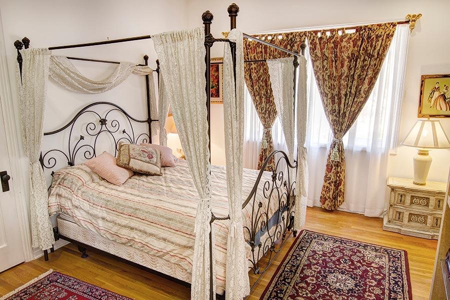 10075 Ojai Santa Paula Road Ojai, CA 93023 - Photo 9 of 17 a bedroom with a bed and a window