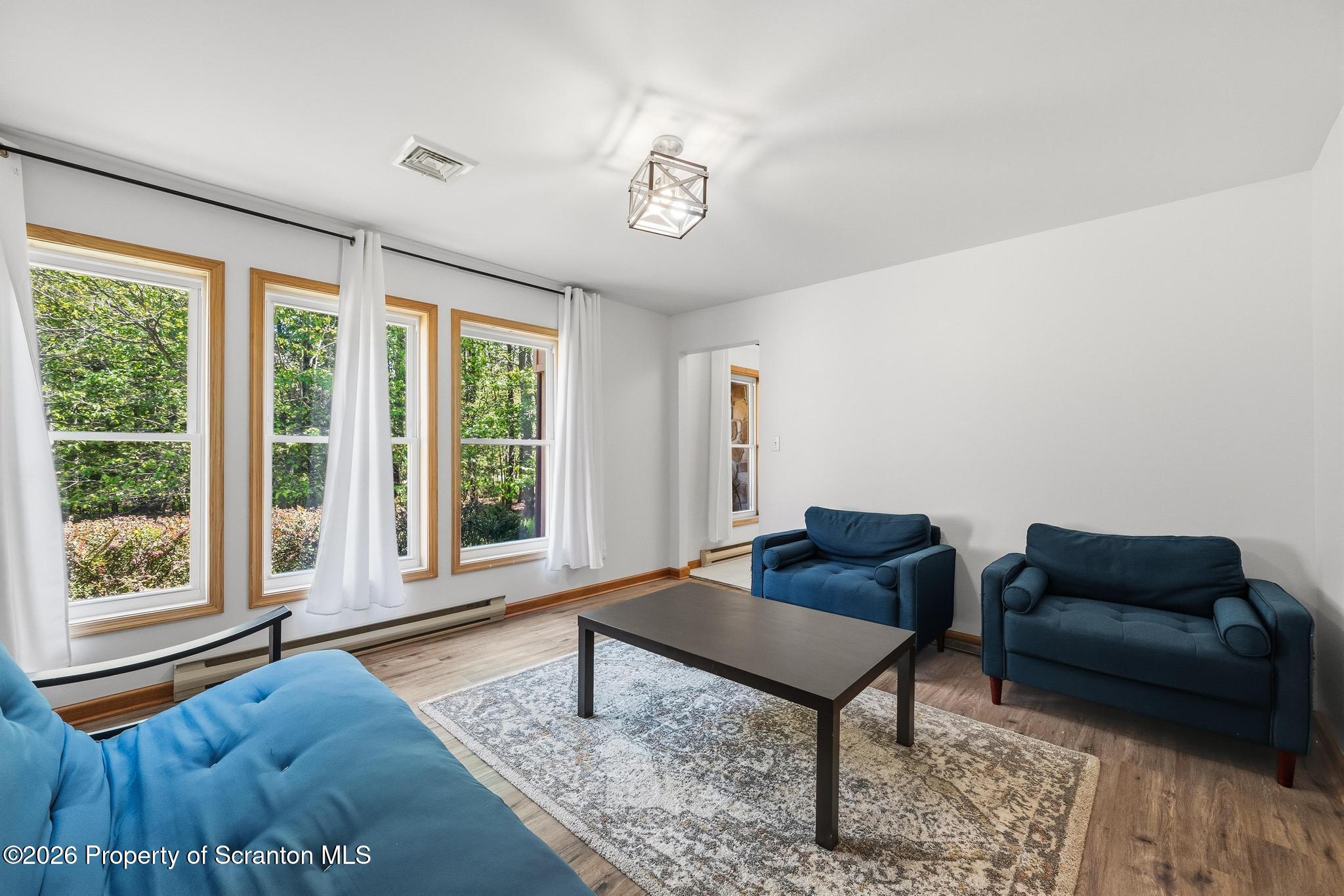58 Bender Road Gouldsboro, PA 18424 - Photo 33 of 55 a living room with furniture and a window