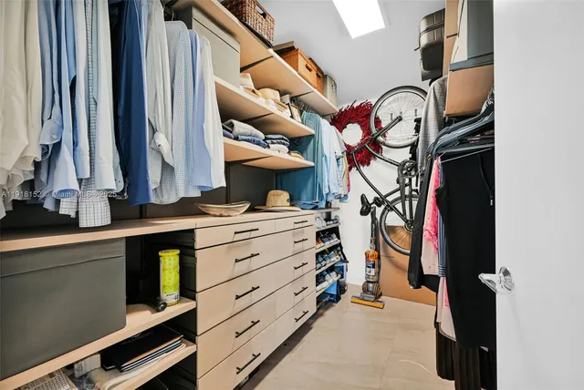 a bathroom with a double vanity sink toilet and mirror