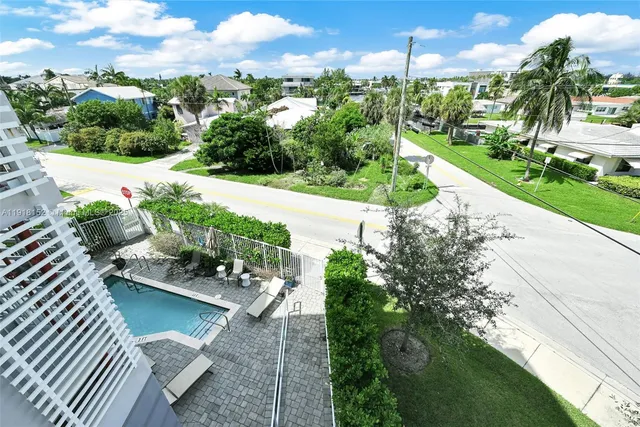 a view of a garden with houses