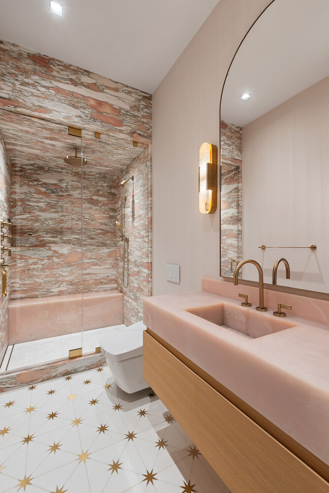 83 Spring Street, Unit 3 Manhattan, NY 10012 - Photo 10 of 24 a bathroom with a sink a toilet and shower