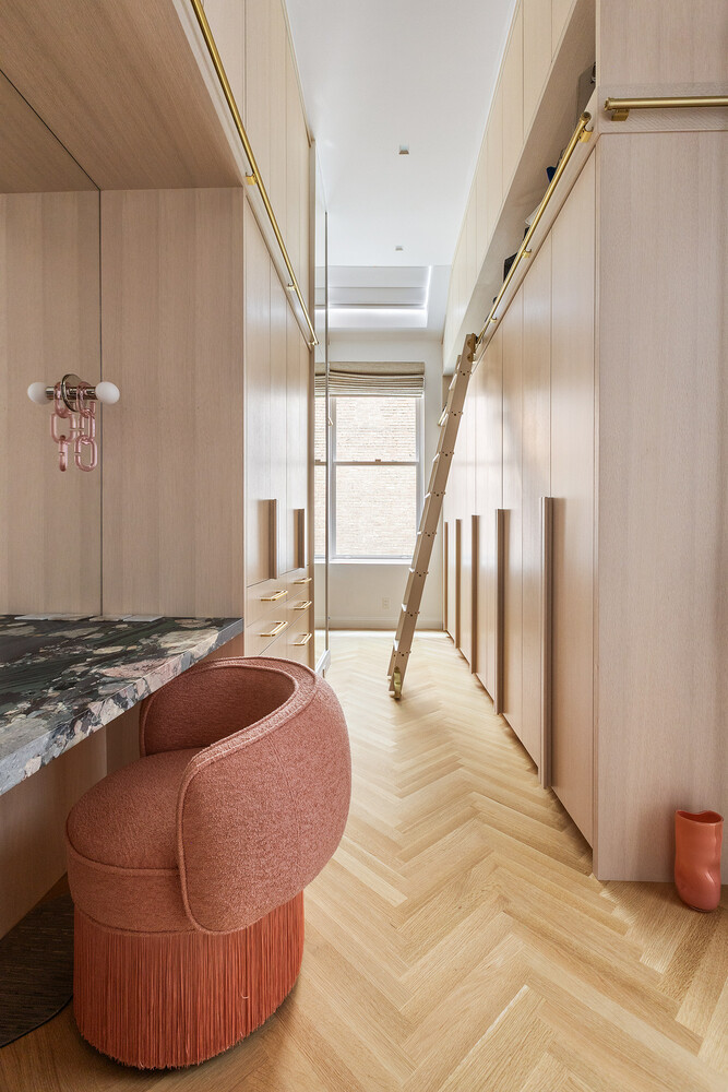 83 Spring Street, Unit 3 Manhattan, NY 10012 - Photo 13 of 24 a bedroom with a bed and wooden floor