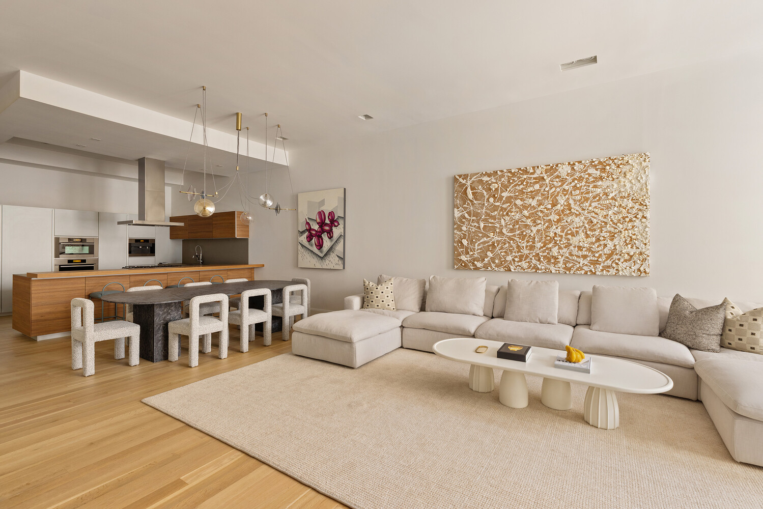 83 Spring Street, Unit 3 Manhattan, NY 10012 - Photo 8 of 24 a living room with furniture and a wooden floor