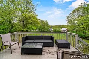 a view of balcony with furniture