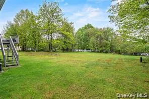 a view of a field with trees