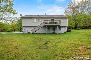 a view of a house with a garden and deck