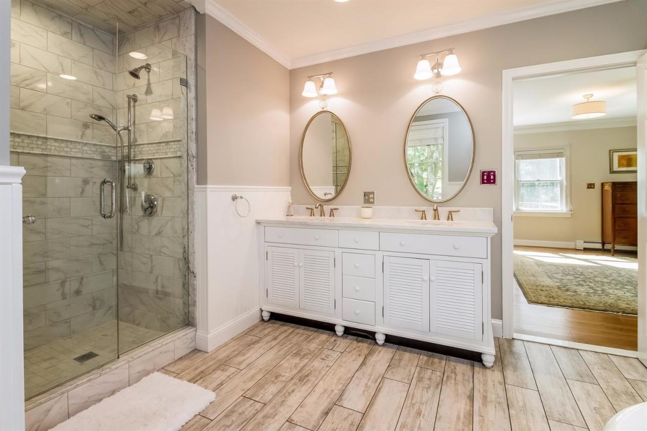 41 Harbor Hill Road Chatham, MA 02633 - Photo 16 of 35 a bathroom with a double vanity sink mirror and shower