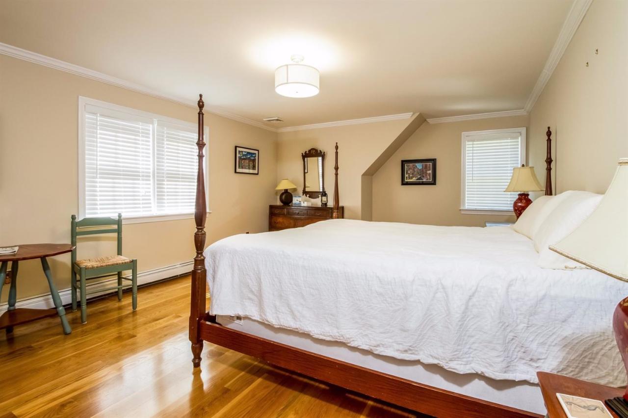 41 Harbor Hill Road Chatham, MA 02633 - Photo 24 of 35 a bedroom with a bed and wooden floor