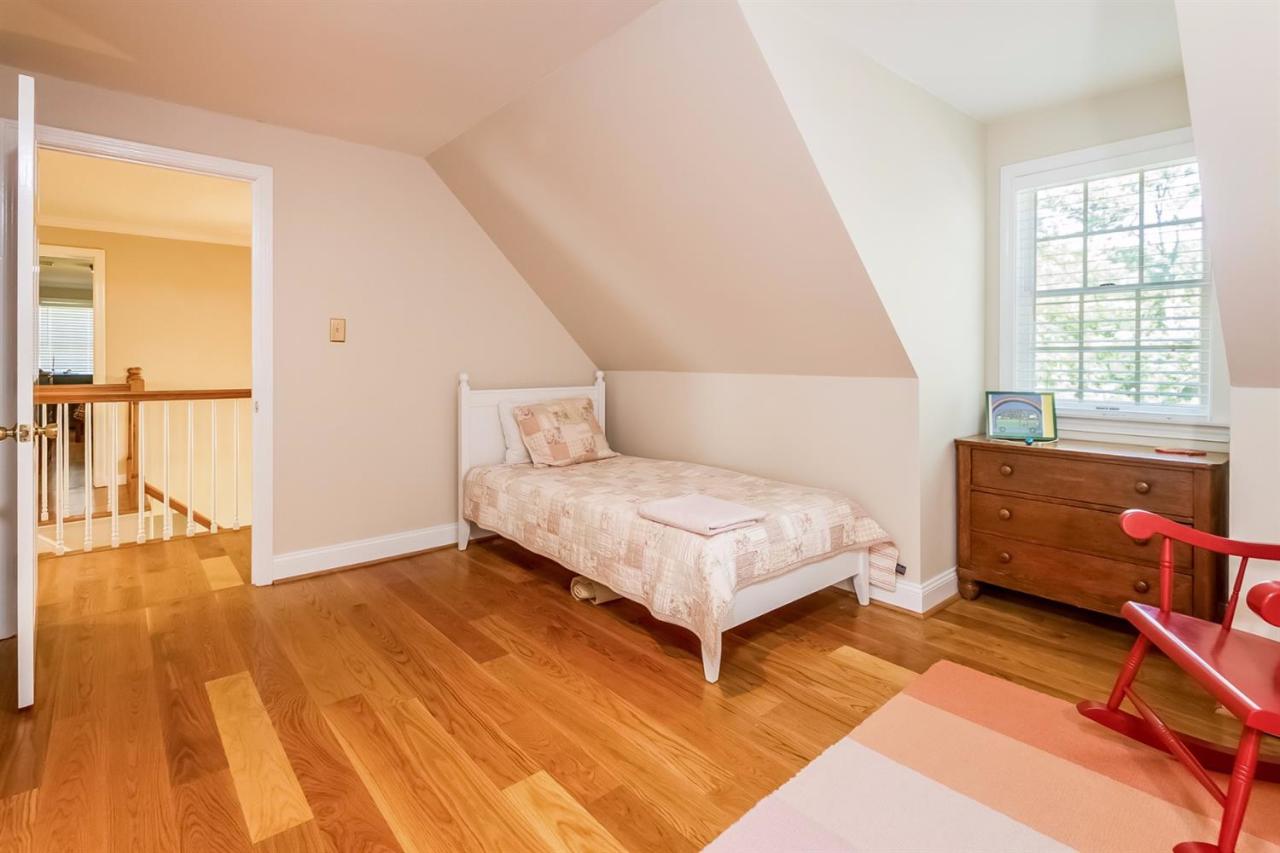 41 Harbor Hill Road Chatham, MA 02633 - Photo 28 of 35 a bedroom with a bed and wooden floor