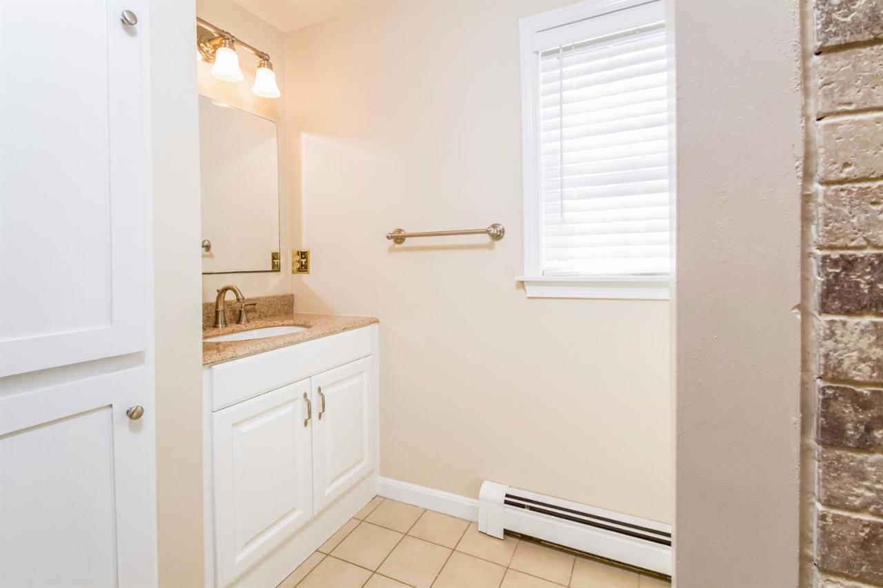 41 Harbor Hill Road Chatham, MA 02633 - Photo 30 of 35 a bathroom with a sink and a mirror