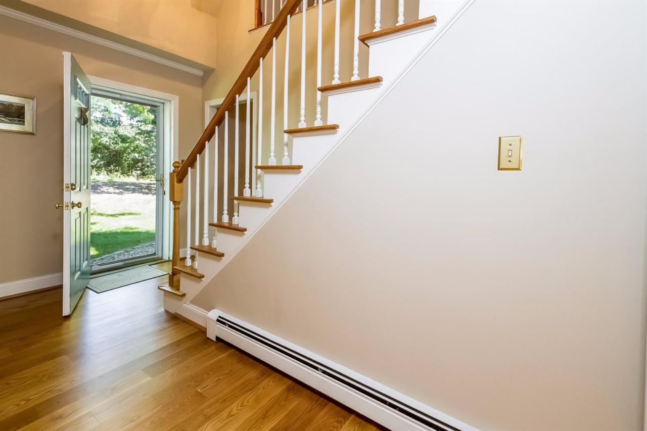 41 Harbor Hill Road Chatham, MA 02633 - Photo 5 of 35 a view of staircase with wooden floor and a rug