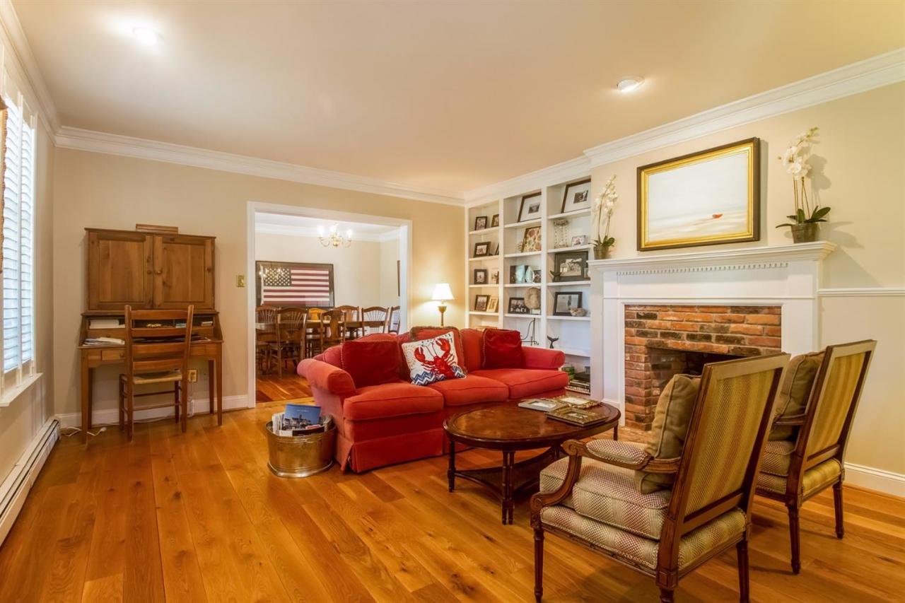 41 Harbor Hill Road Chatham, MA 02633 - Photo 6 of 35 a living room with furniture a fireplace and a flat screen tv